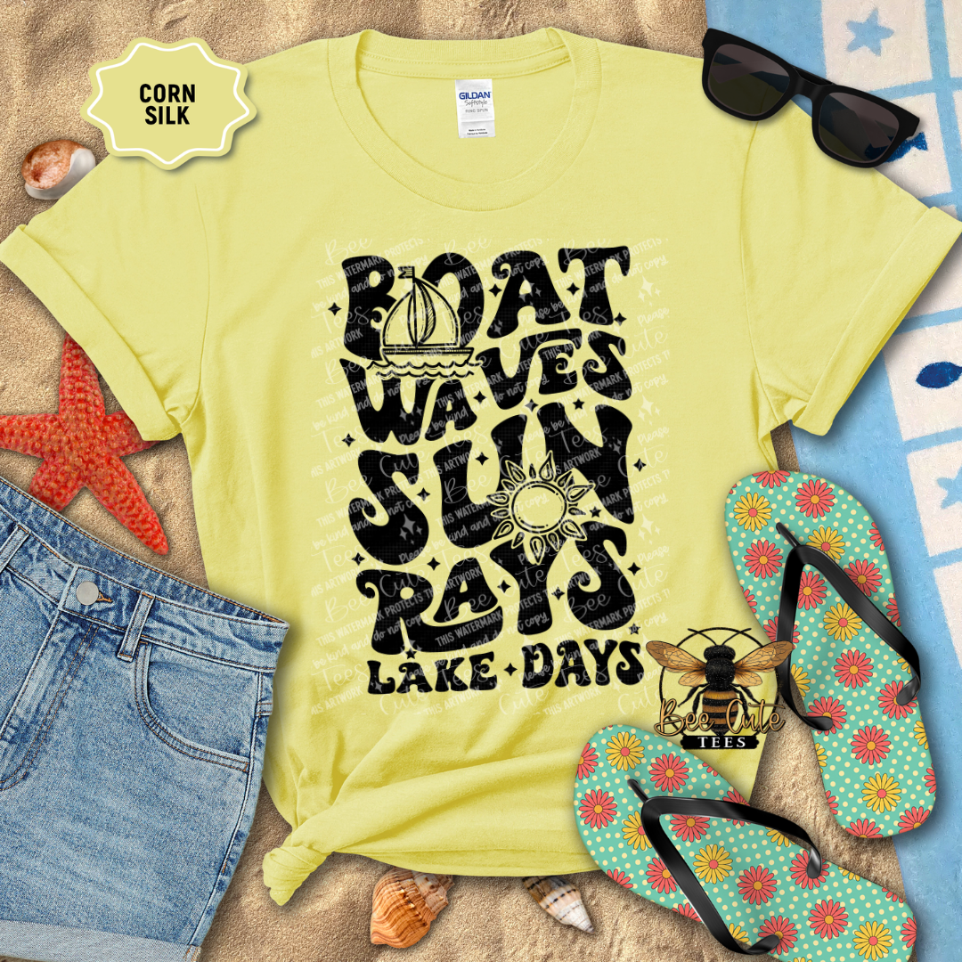 Yellow t-shirt with beach-themed design, sunglasses, flip-flops, and beach accessories on a sandy background.