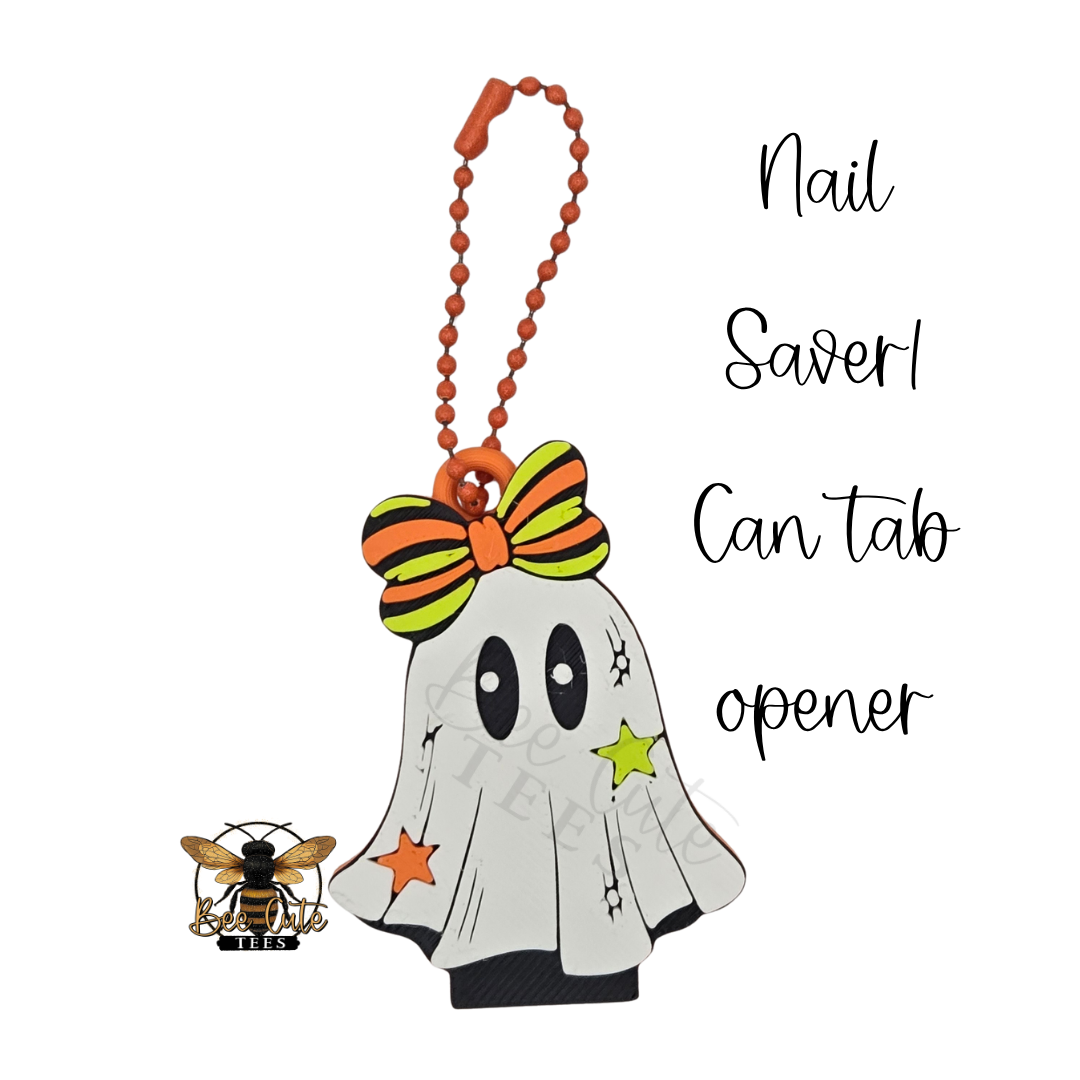 Halloween-themed ghost nail saver can tab opener with an orange ball-chain keychain, orange and green bow, and star details, shown on a white background with text reading 'Nail Saver! Can tab opener' and a small bee logo.