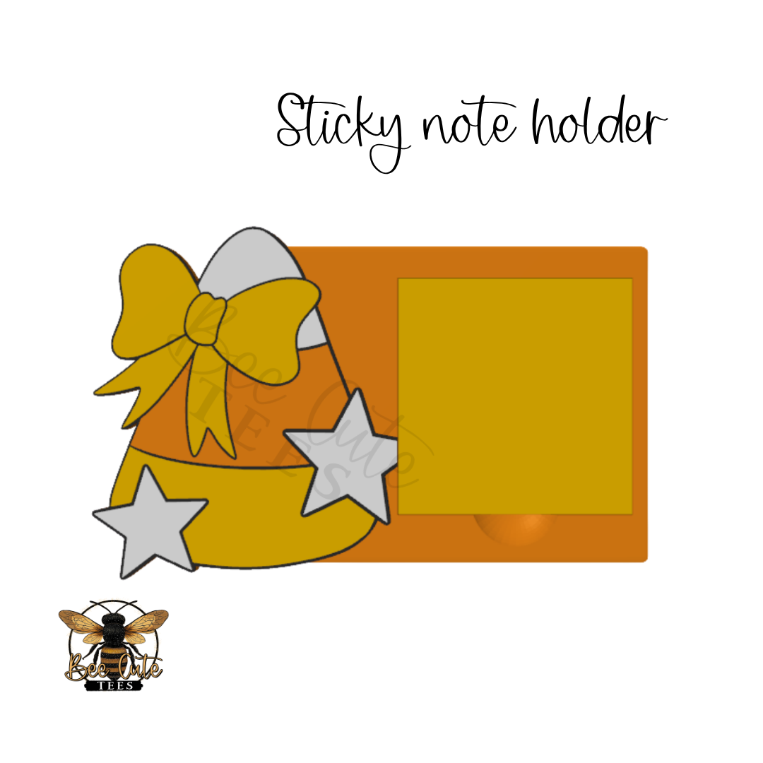 A yellow sticky note holder with a large yellow bow, two gray stars, and a blank yellow square on a white background. The text 'Sticky note holder' appears above, and a bee logo is in the bottom-left corner.