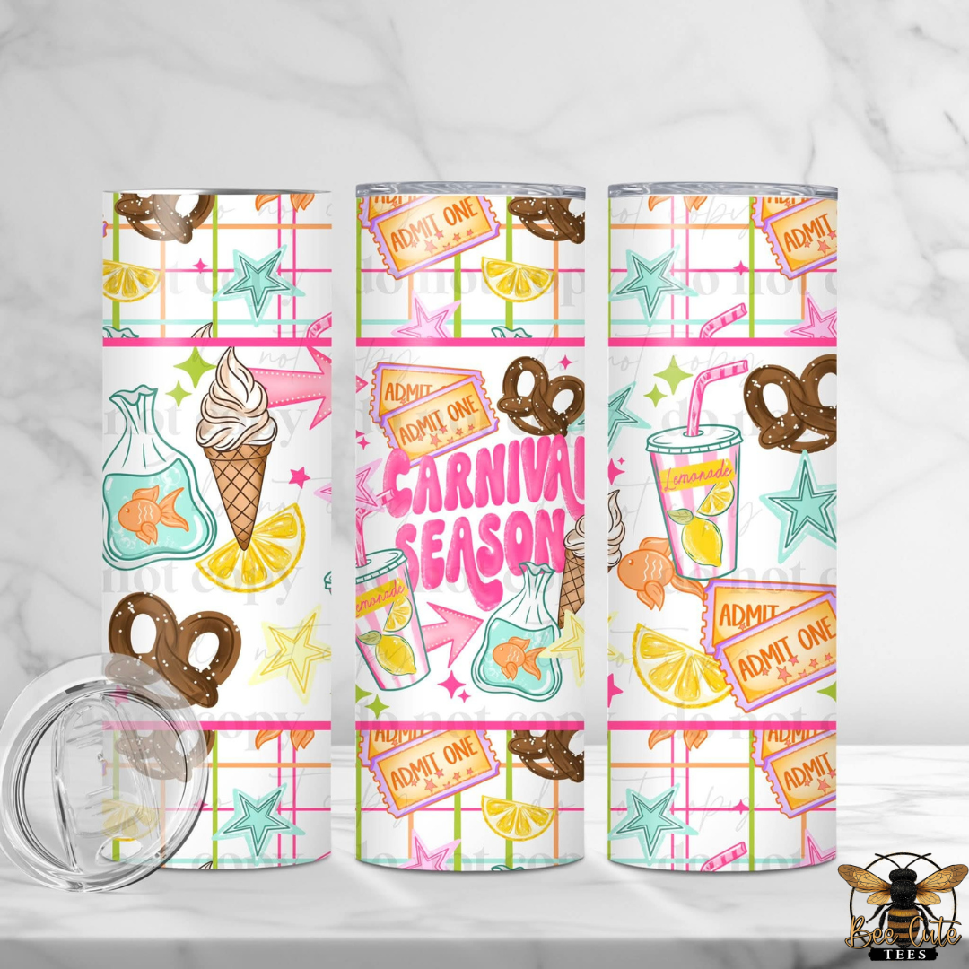Three clear tumblers with a colorful carnival-themed print are displayed on a white marble surface. The print features pink and green grid lines, pretzels, ice cream cones, fish bags, starfish, lemon slices, and orange 'ADMIT ONE' tickets, with the words 'CARNIVAL SEASON' in the center.