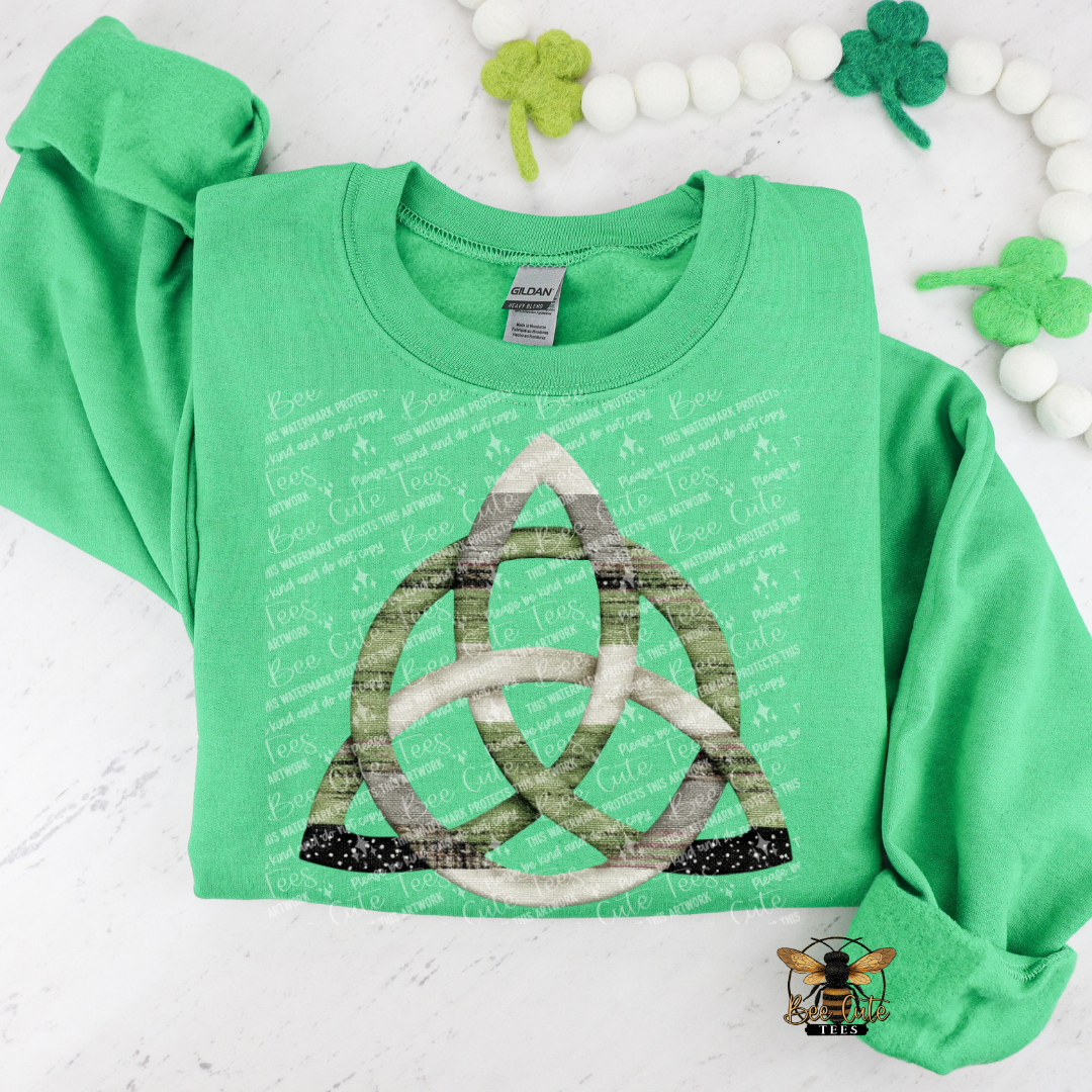 Green long-sleeve shirt with a Trinity Knot design on a white background with shamrocks.