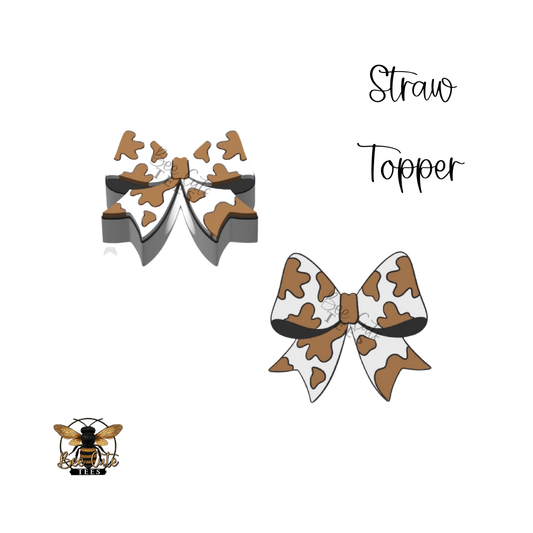 Cow print bow with straw topper design on a white background