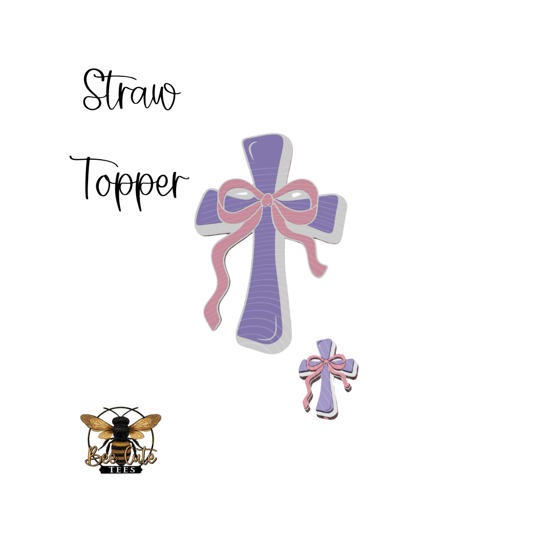 Cross-shaped straw topper with pink bow on a white background, featuring the brand 'Straw Topper'.