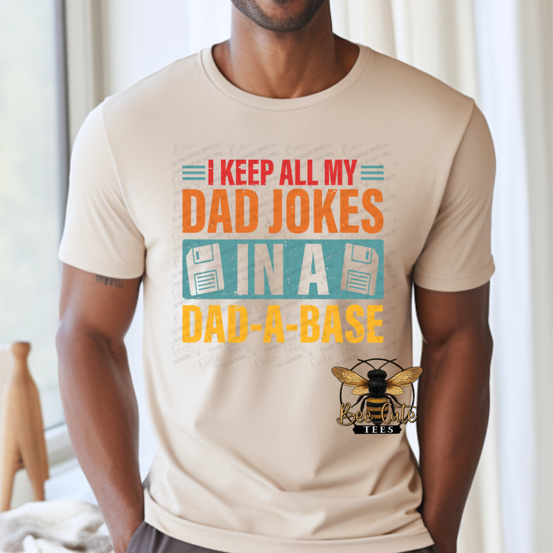 Person wearing a beige t-shirt with a graphic and text design.