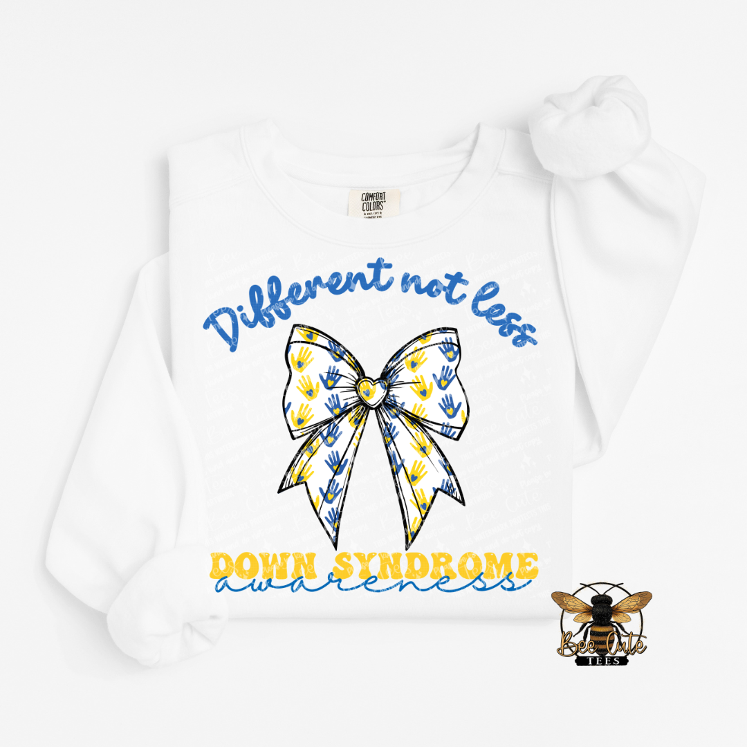 White sweatshirt with a bow design and text about Down Syndrome awareness on a white background.