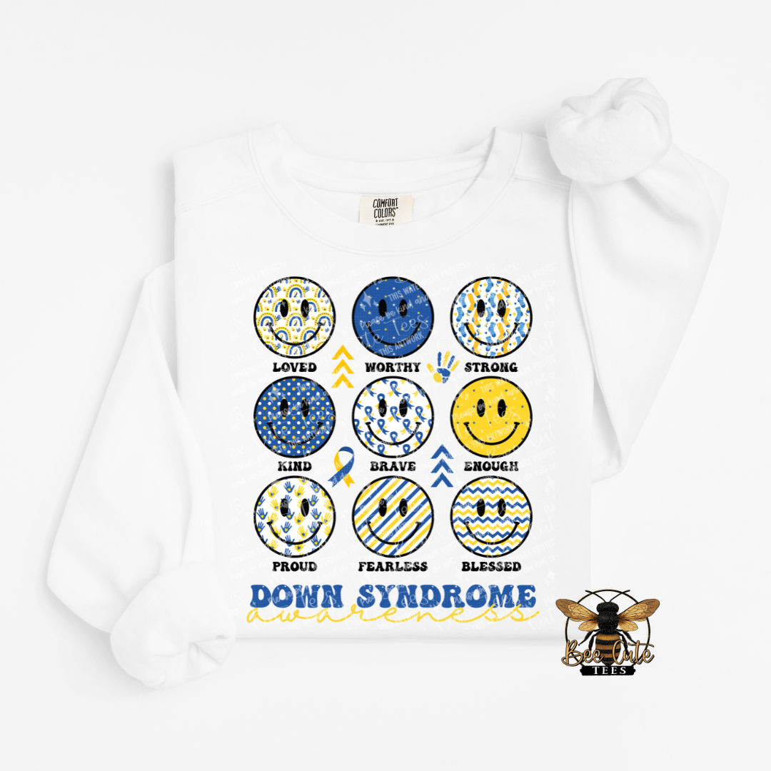 White sweatshirt with colorful smiley face designs and text on a white background