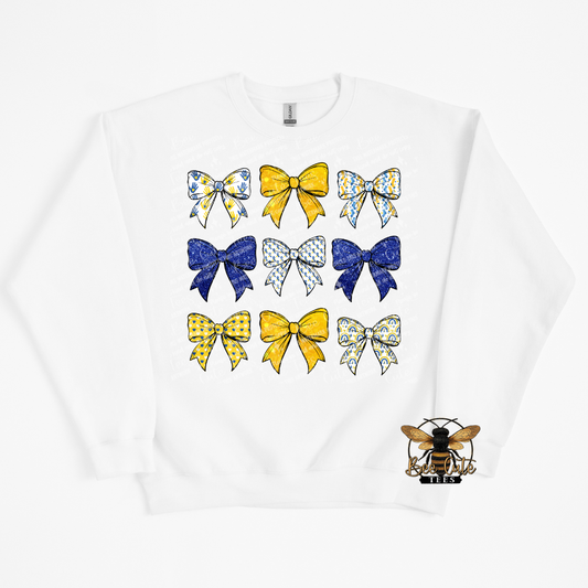 White sweatshirt with colorful bow designs and a bee logo on a white background