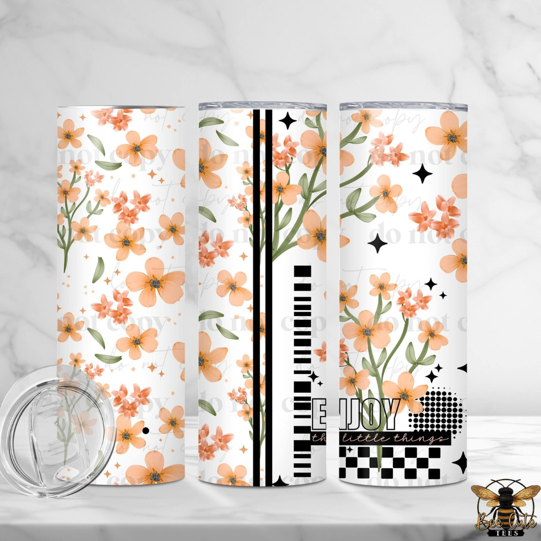 Three floral-patterned tumblers on a white background