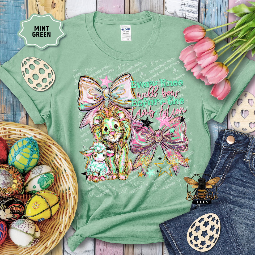 Mint green t-shirt with decorative design and text, surrounded by Easter decorations.