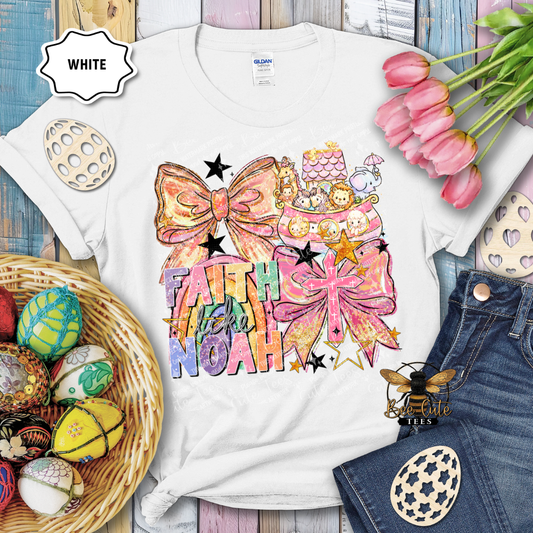White t-shirt with colorful design featuring bows and text, surrounded by Easter decorations.