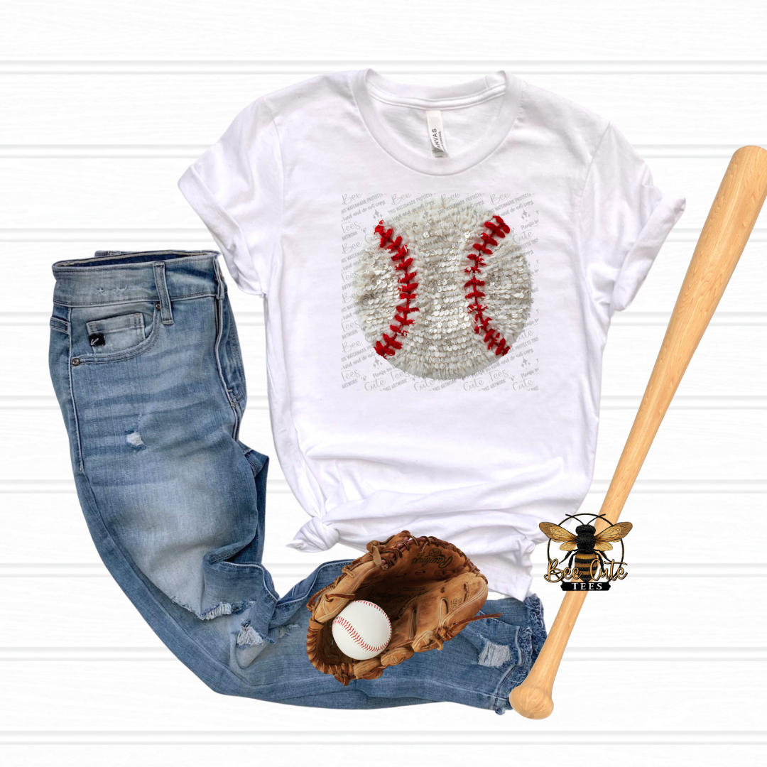 White t-shirt with baseball graphic, blue jeans, baseball glove, and bat on a white background