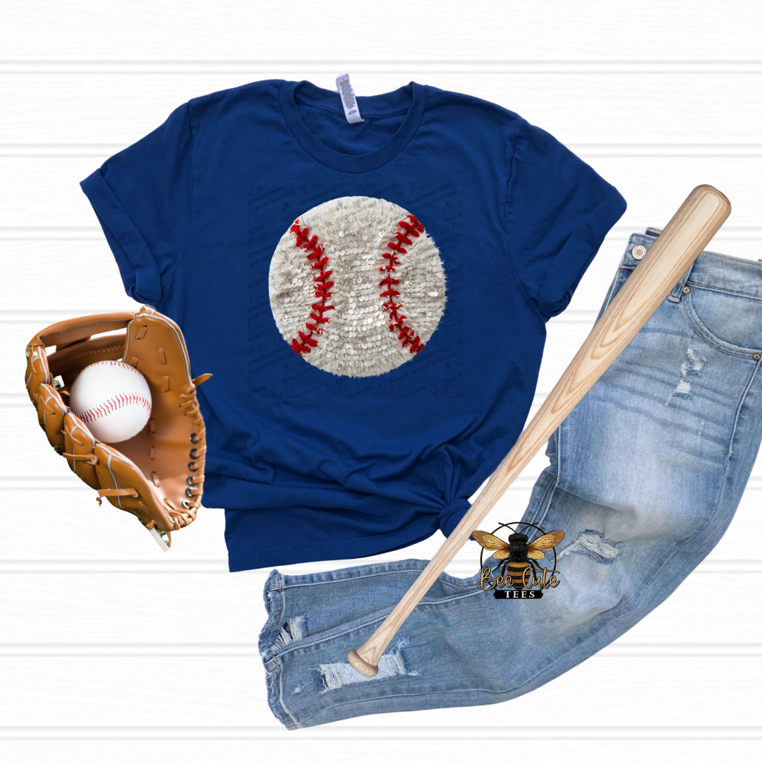 Blue t-shirt with baseball graphic, baseball, glove, and bat on a white background