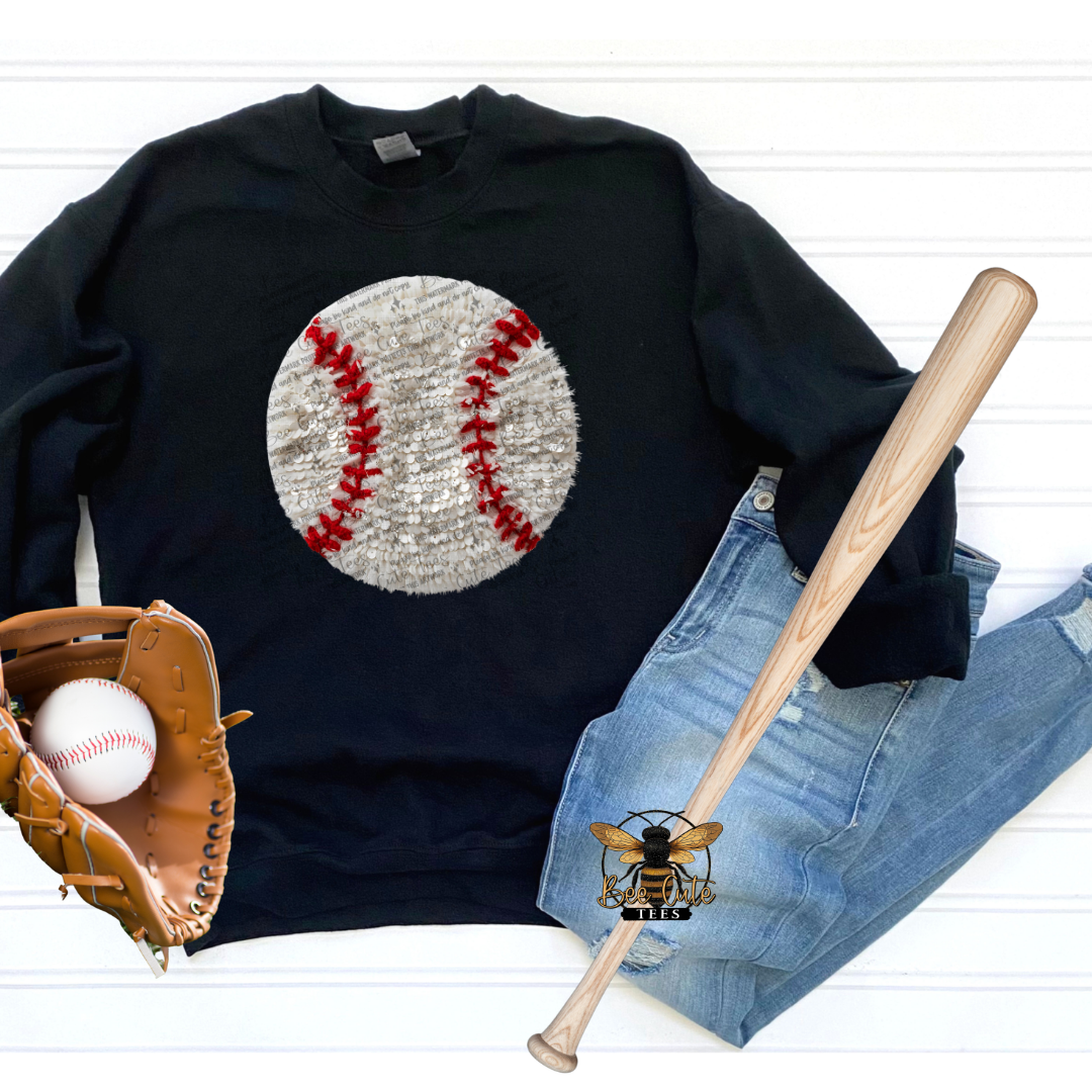 Black sweatshirt with baseball graphic, baseball, bat, and glove on a white background