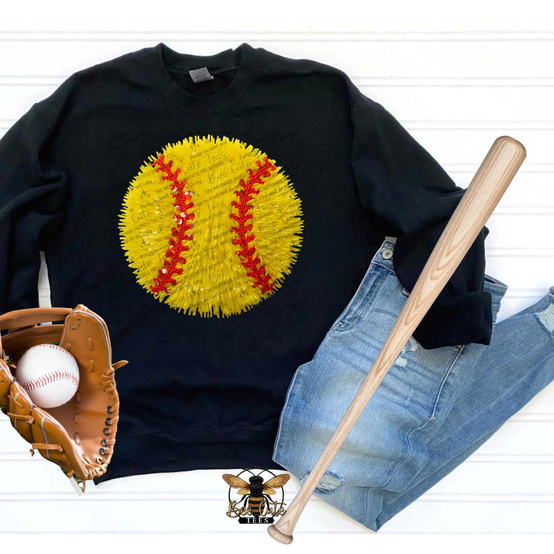 Black sweatshirt with yellow baseball graphic, baseball bat, and baseball glove on a white background