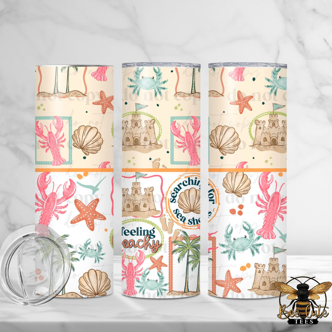 Three tumblers with beach-themed designs on a white background