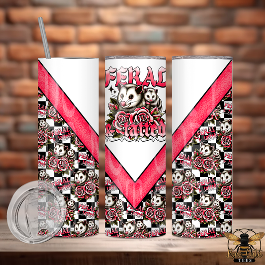 Tumbler with 'Feral Kitties' design featuring cats, roses, and a red chevron pattern on a brick background.