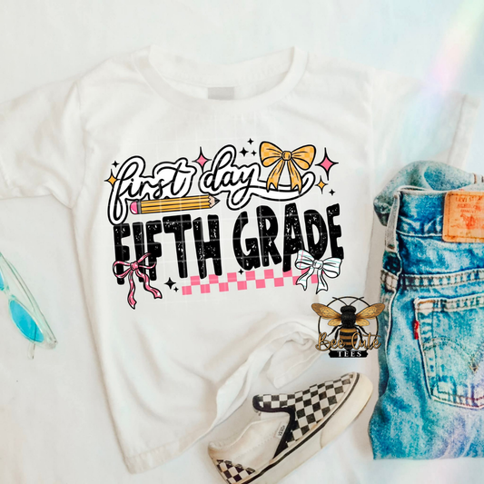 White t-shirt with 'first day fifth grade' text, denim shorts, and checkered shoes on a white background.