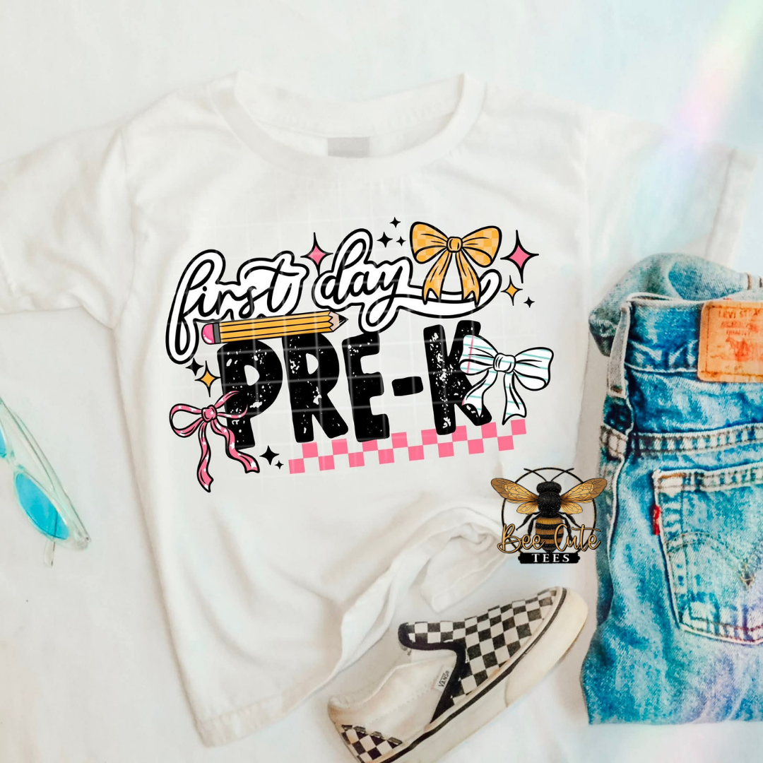 White t-shirt with 'First Day Pre-K' design, denim shorts, and checkered shoes on a white background.
