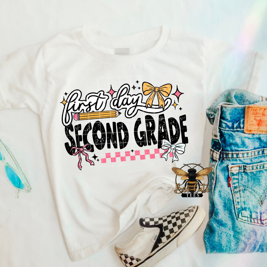 White t-shirt with 'first day second grade' text, denim shorts, and checkered shoes on a white background.