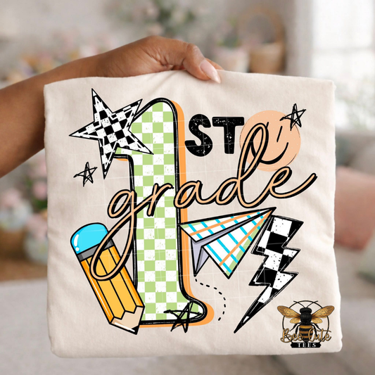 Folded white-colored unisex T-shirt held up by a hand, featuring a colorful "1st Grade" graphic. The design includes green checkered number four, bold black lettering, peach script, a pencil, paper airplane, smiley face, lightning bolt, stars, and playful doodles. A fun, retro-inspired back-to-school design perfect for fourth grade teachers and students.
