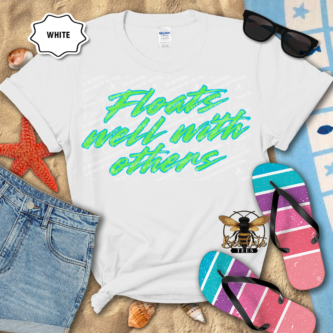 White t-shirt with colorful text, sunglasses, and flip-flops on a beach-themed background