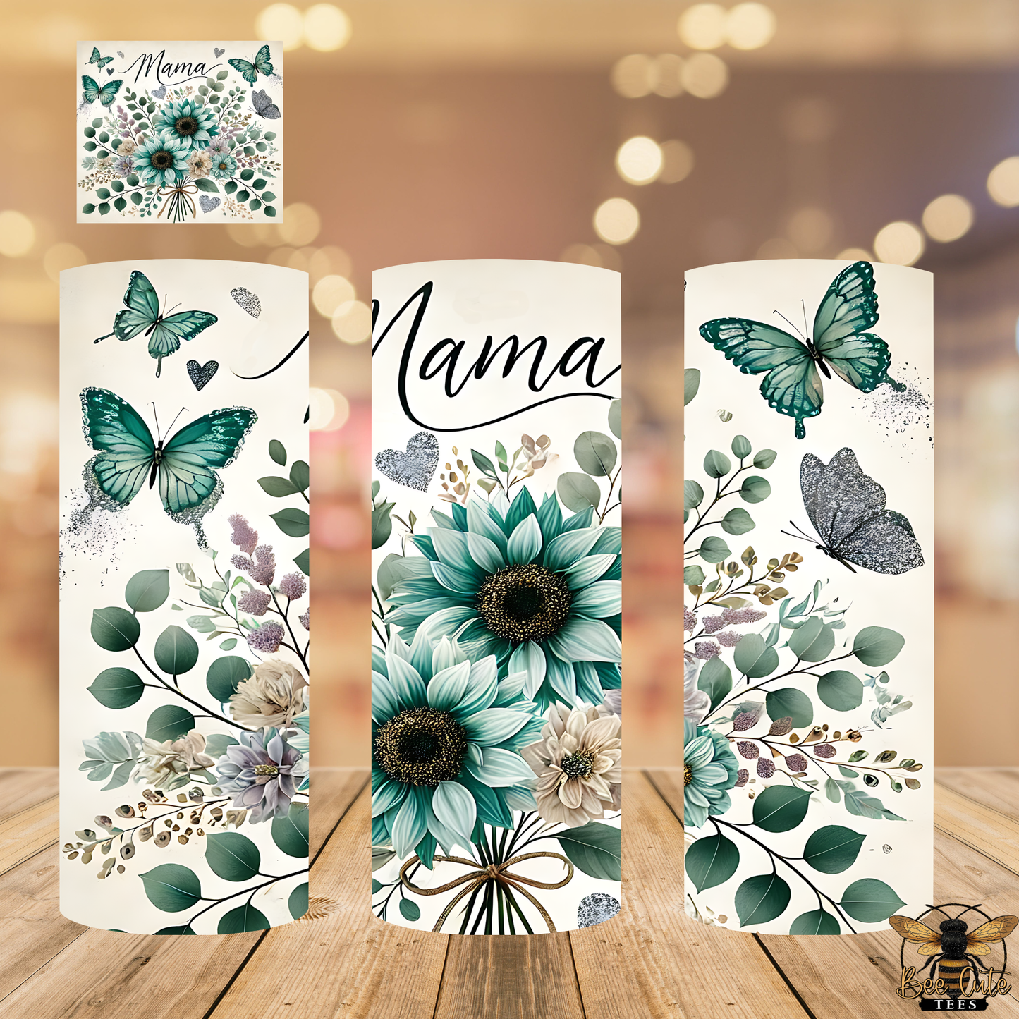 Three decorative candles with floral and butterfly designs on a wooden surface.
