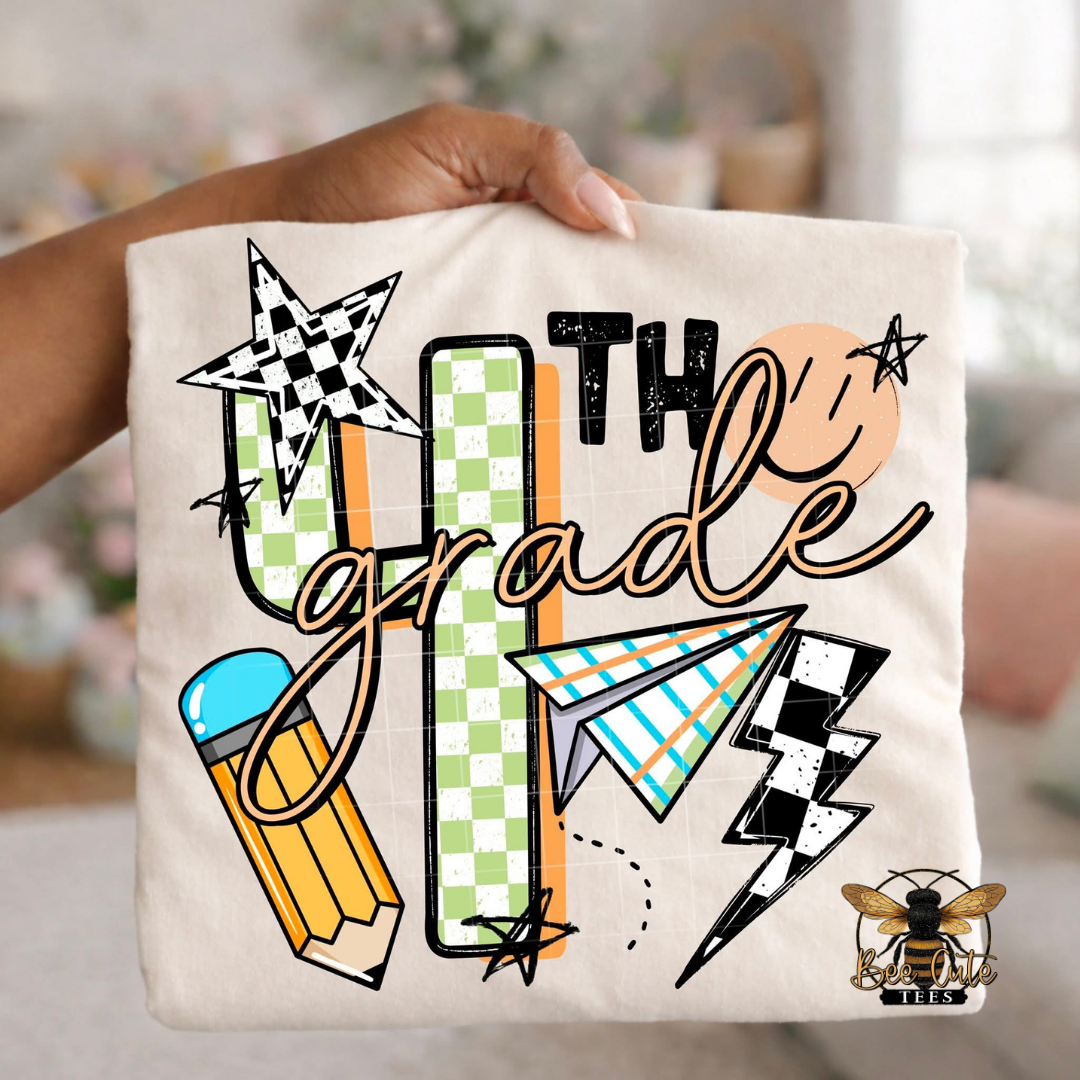 Folded white-colored unisex T-shirt held up by a hand, featuring a colorful "4th Grade" graphic. The design includes green checkered number four, bold black lettering, peach script, a pencil, paper airplane, smiley face, lightning bolt, stars, and playful doodles. A fun, retro-inspired back-to-school design perfect for fourth grade teachers and students.
