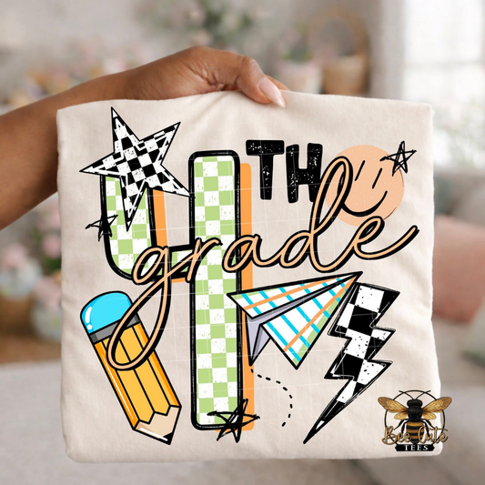 Folded white-colored unisex T-shirt held up by a hand, featuring a colorful "4th Grade" graphic. The design includes green checkered number four, bold black lettering, peach script, a pencil, paper airplane, smiley face, lightning bolt, stars, and playful doodles. A fun, retro-inspired back-to-school design perfect for fourth grade teachers and students.
