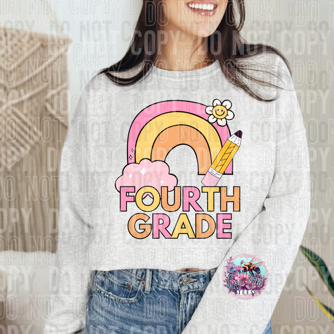 Person wearing a white sweatshirt with a rainbow and 'Fourth Grade' design.