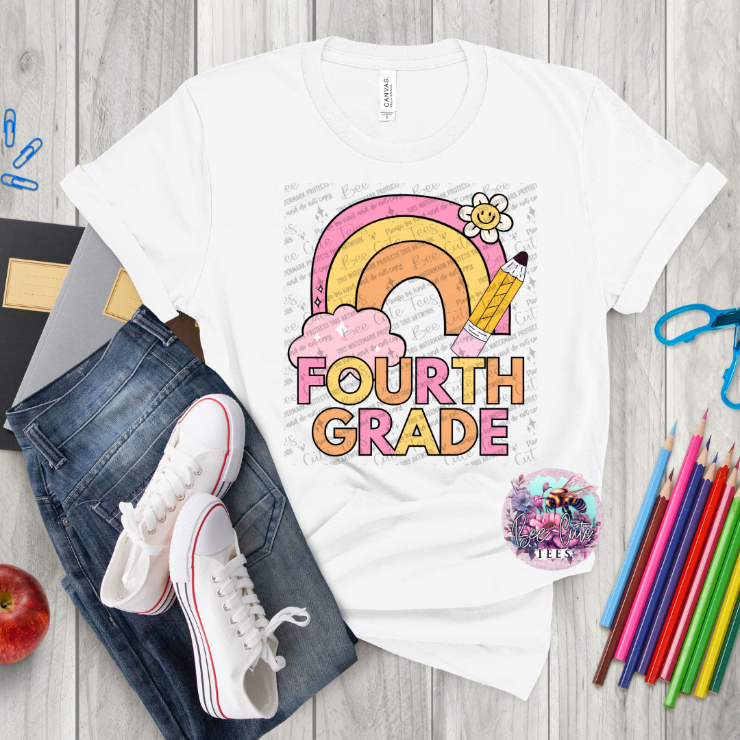 White t-shirt with 'Fourth Grade' design on a wooden surface with jeans, sneakers, and school supplies.