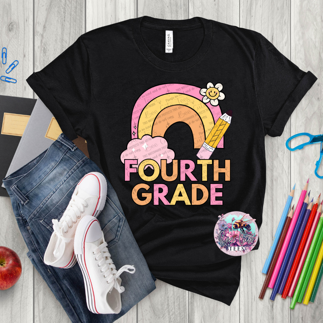 Black t-shirt with 'Fourth Grade' design on a wooden surface with jeans, sneakers, and school supplies.