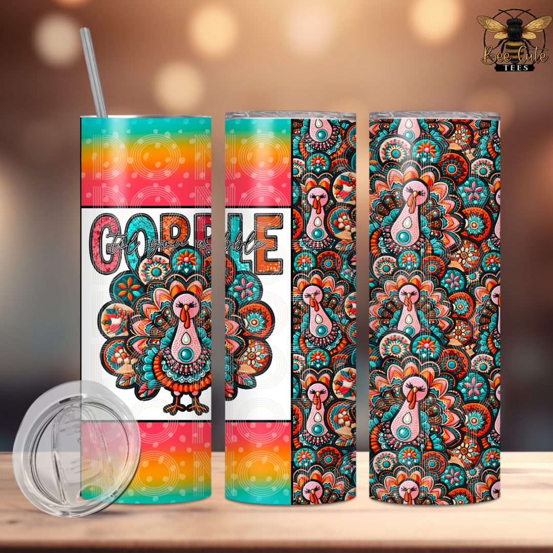 Three views of a skinny tumbler with a colorful Thanksgiving theme, featuring a turkey design,  and a striped gradient top. A clear lid is shown in the bottom left on a wooden table with a blurred background.