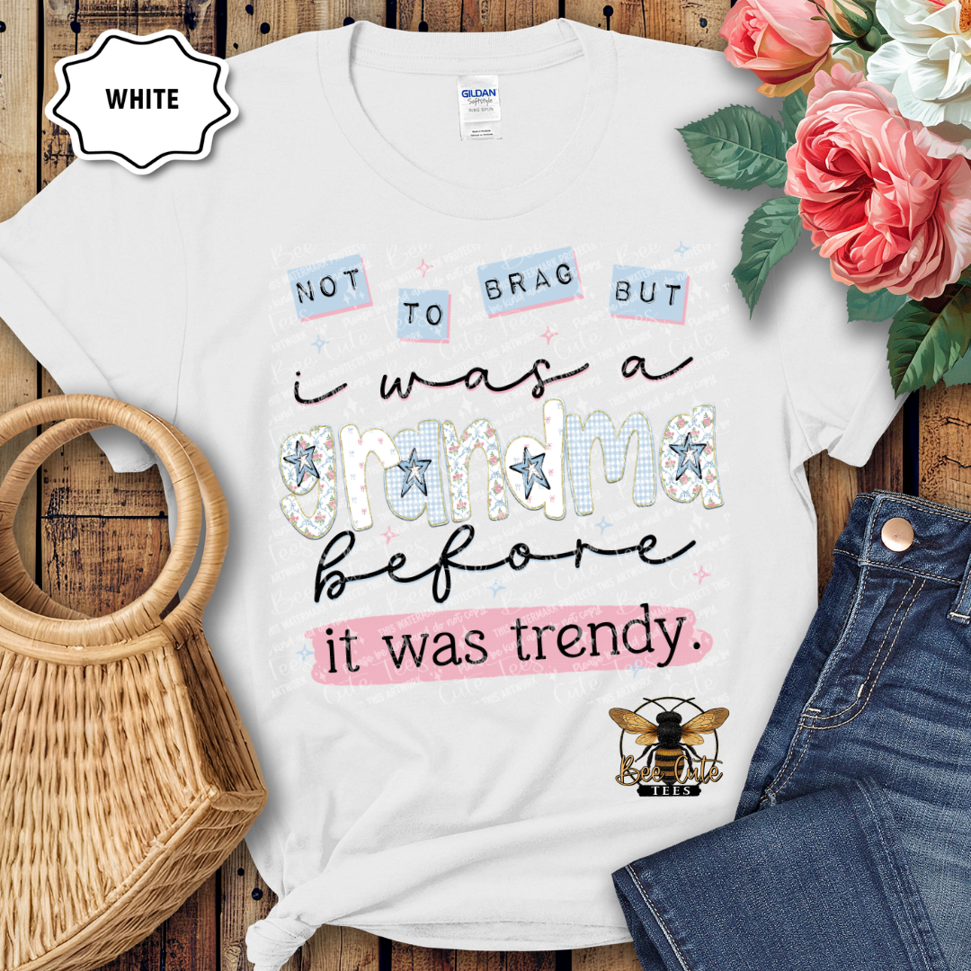 White t-shirt with humorous design on a wooden surface with flowers and jeans.