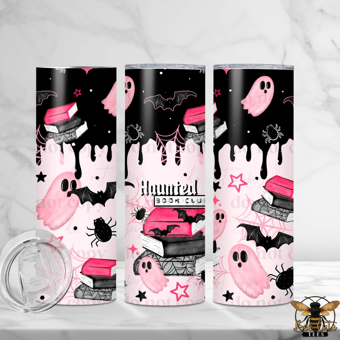 Three slim tumblers with a Halloween-themed print featuring pink ghosts, black bats, books, spiders, and dripping black paint on a black and pink background. A clear lid is shown in the lower left, and a bee logo watermark is in the lower right.