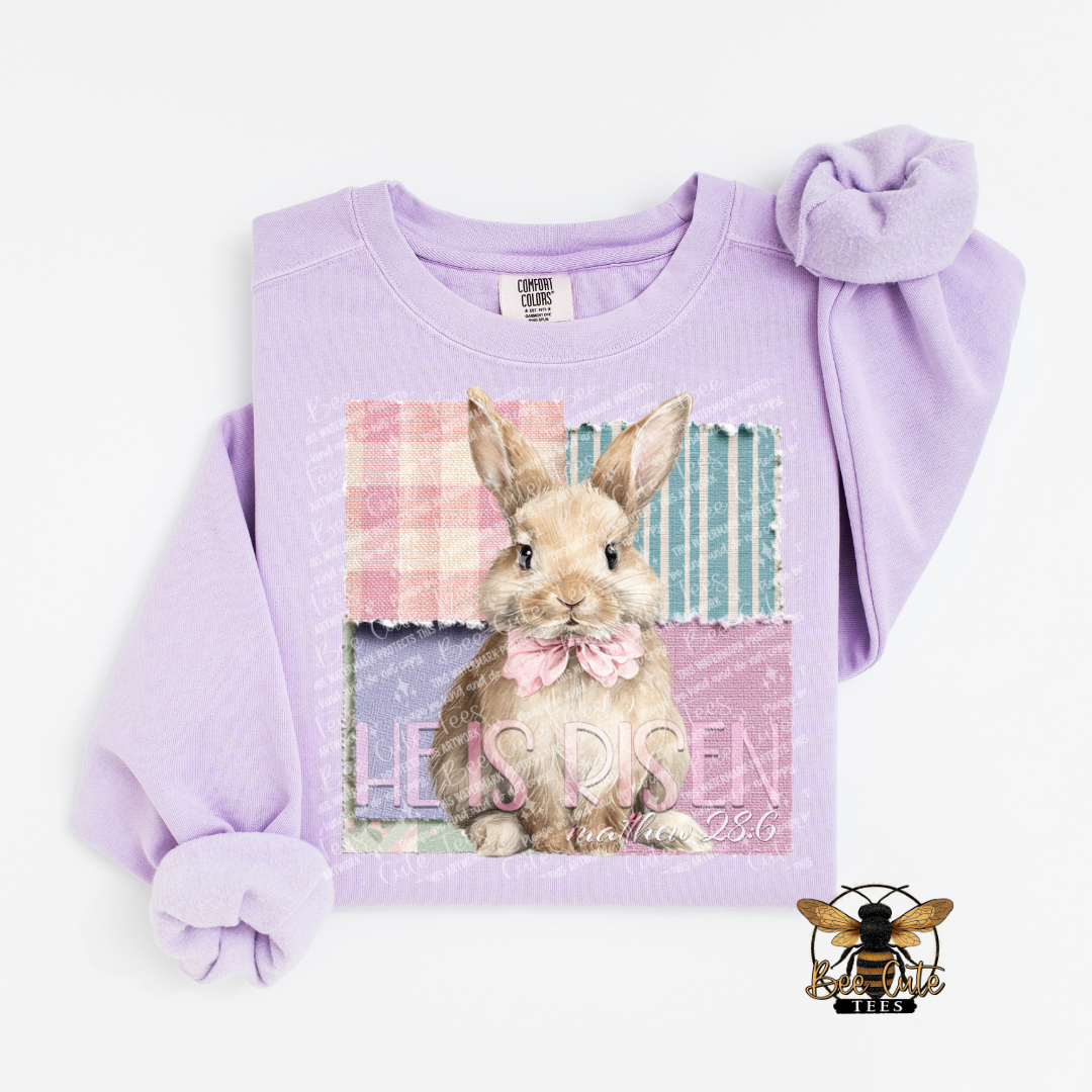 Lavender sweatshirt with a bunny graphic and text on a white background