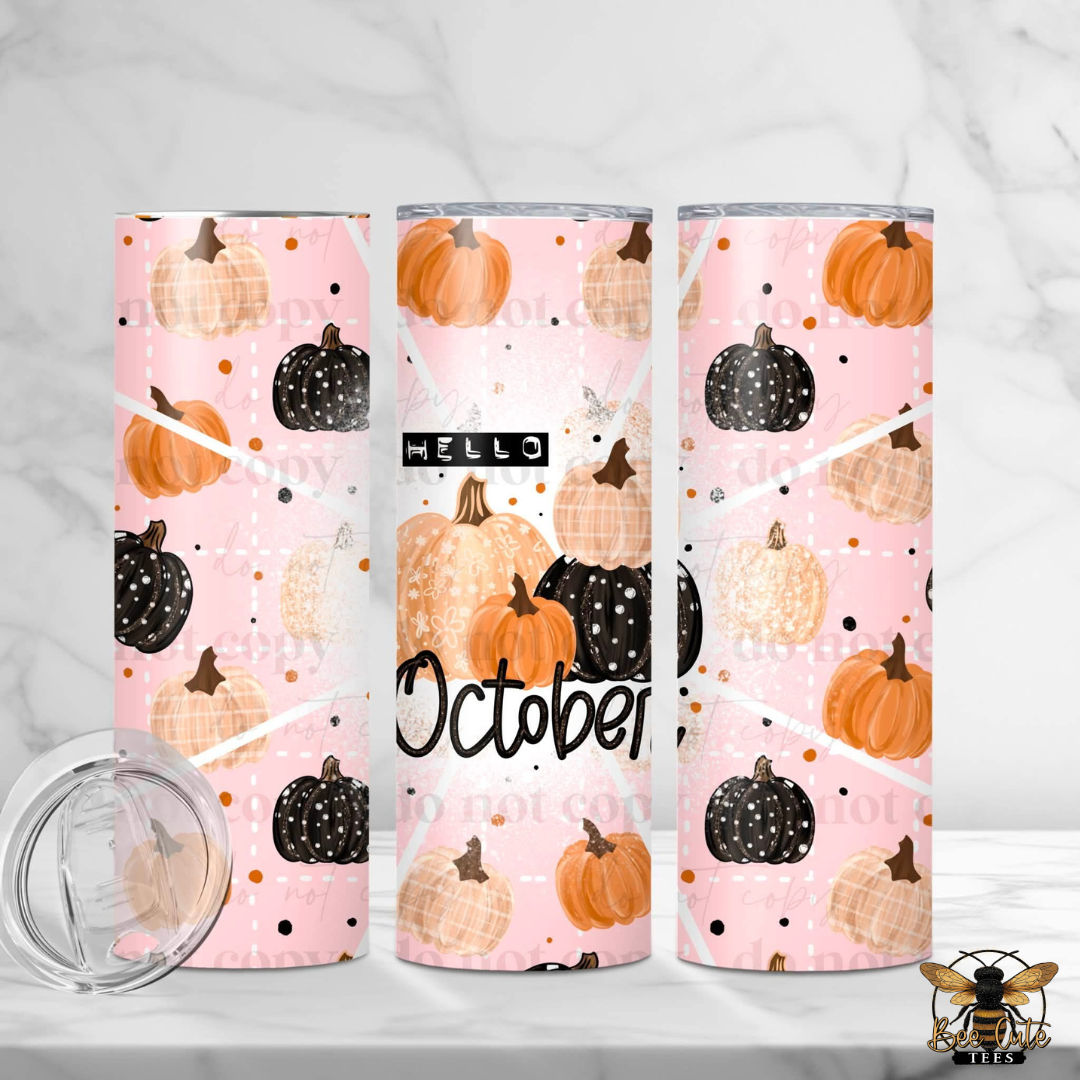 Three slim tumblers with a pink fall pumpkin pattern are displayed on a white marble surface with a matching marble background. The pattern features orange, black, and beige pumpkins, white polka dots, and the text 'HELLO October'.