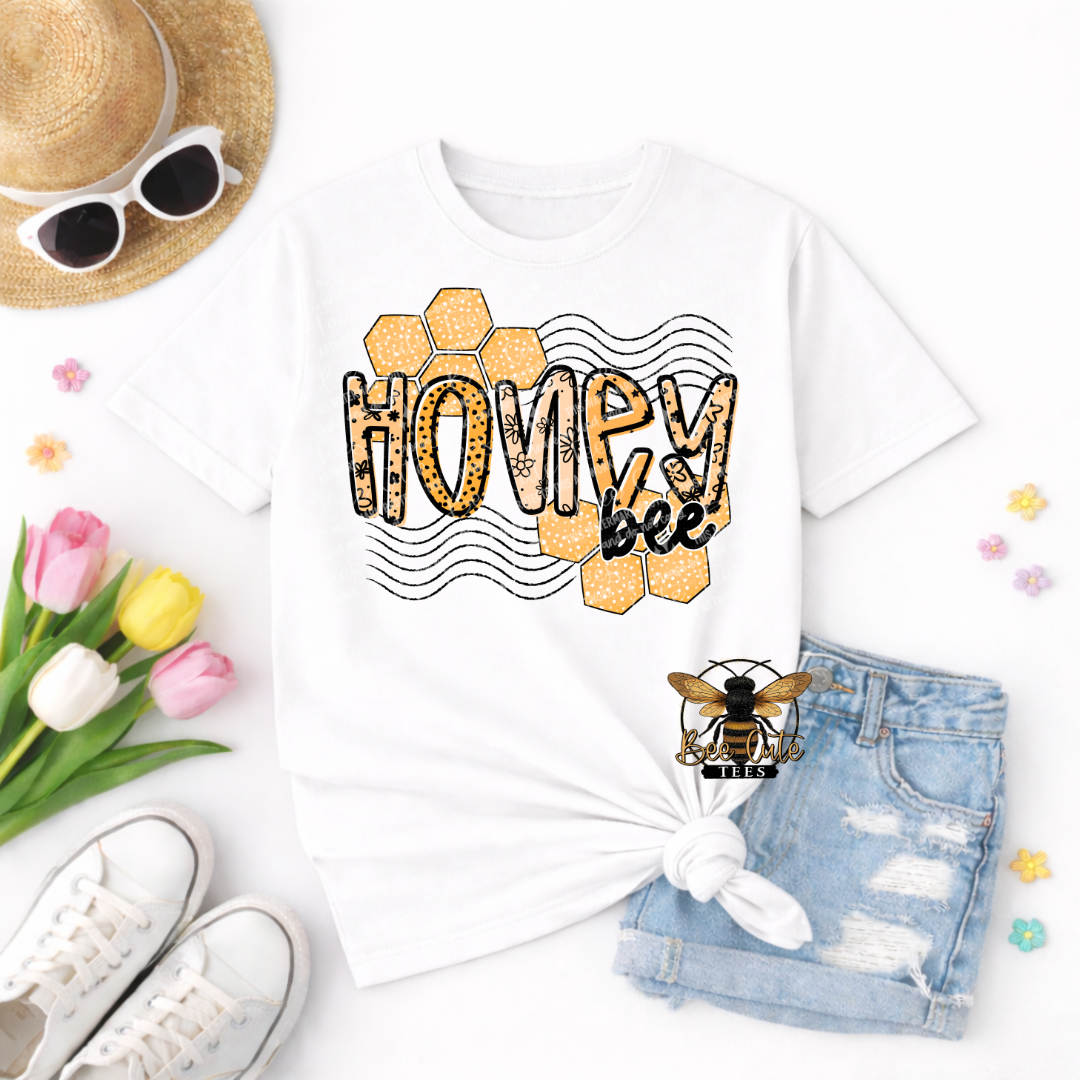 White t-shirt with 'Honey bee' design, sunglasses, hat, shoes, and flowers on a white background