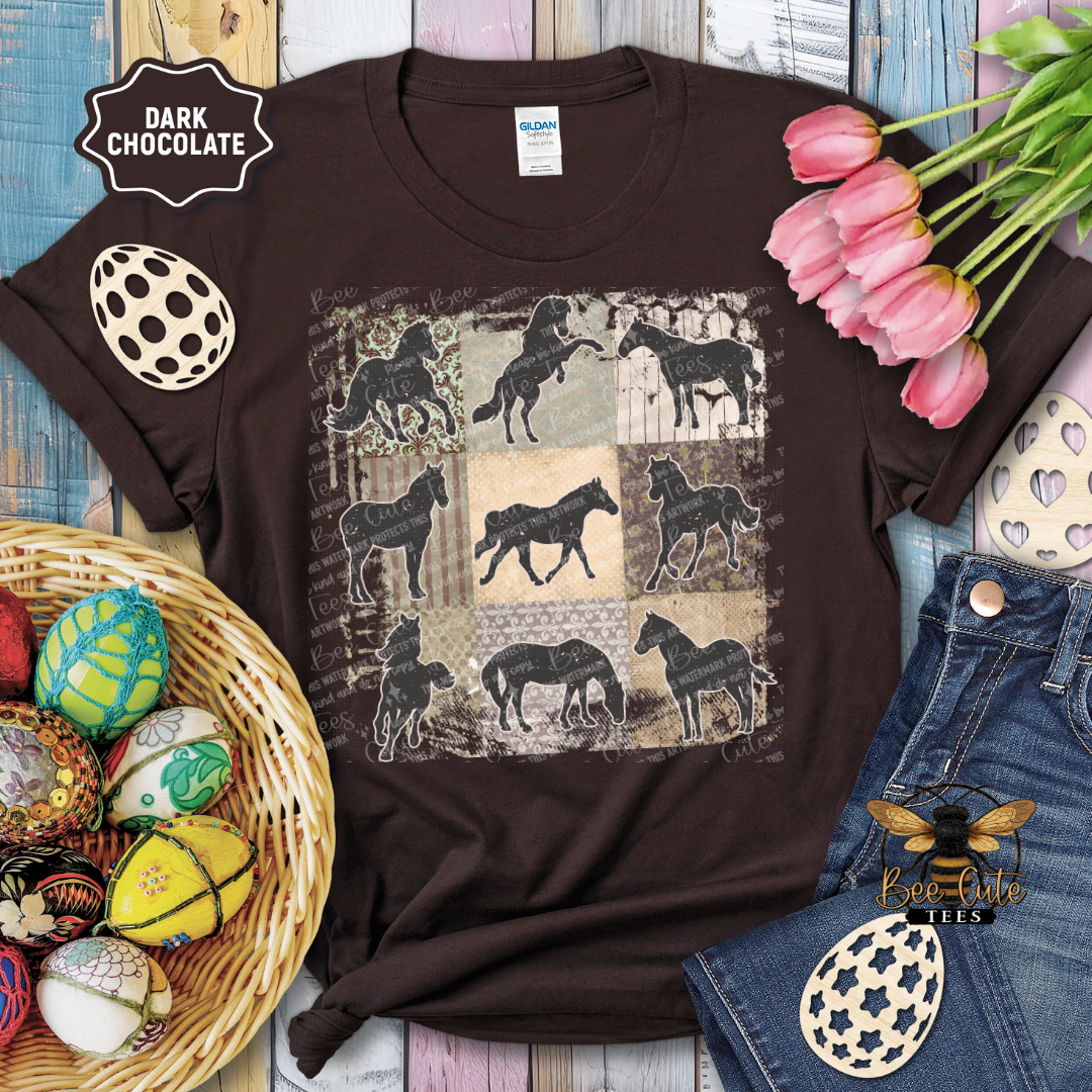 Brown t-shirt with horse pattern on a wooden surface with decorative items.