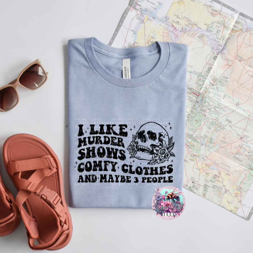 Light blue t-shirt with graphic design and text, sunglasses, sandals, and a map in the background