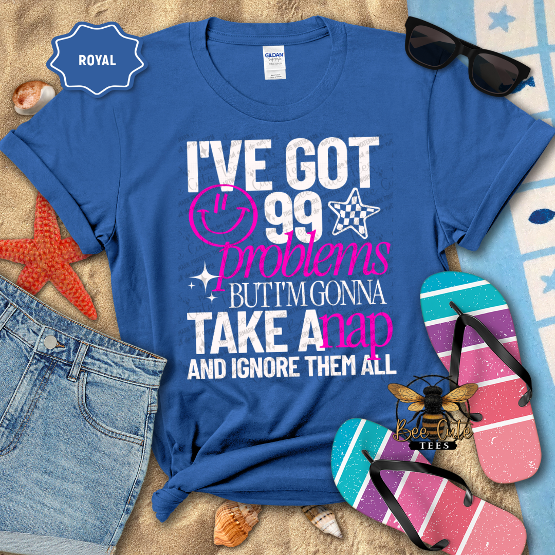 Blue t-shirt with humorous text design on a beach-themed background