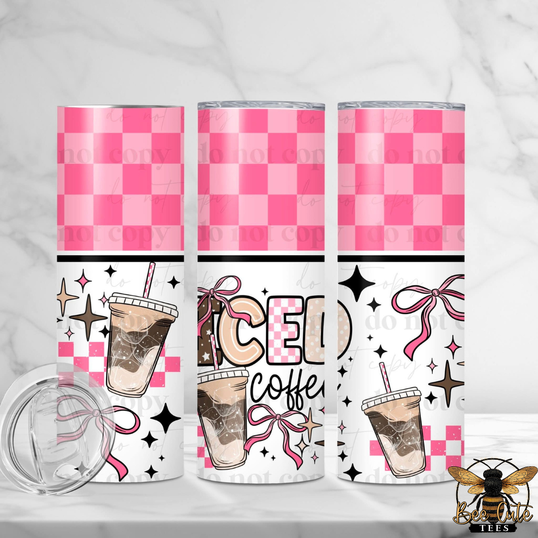 Three pink checkered tumblers with iced coffee design on a white background