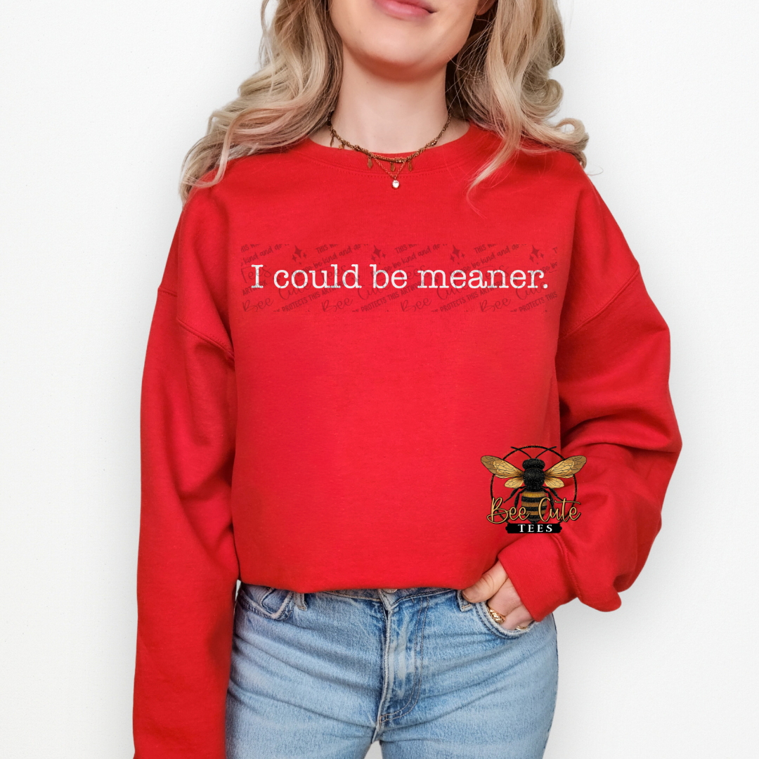 Person wearing a red sweatshirt with text and a logo on a white background