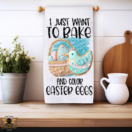 Kitchen towel with Easter design and text hanging on a wooden shelf.
