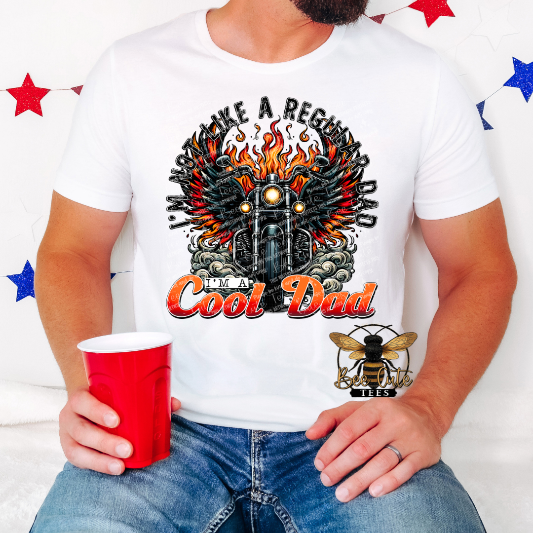 Person wearing a white t-shirt with a graphic design and text, holding a red cup.