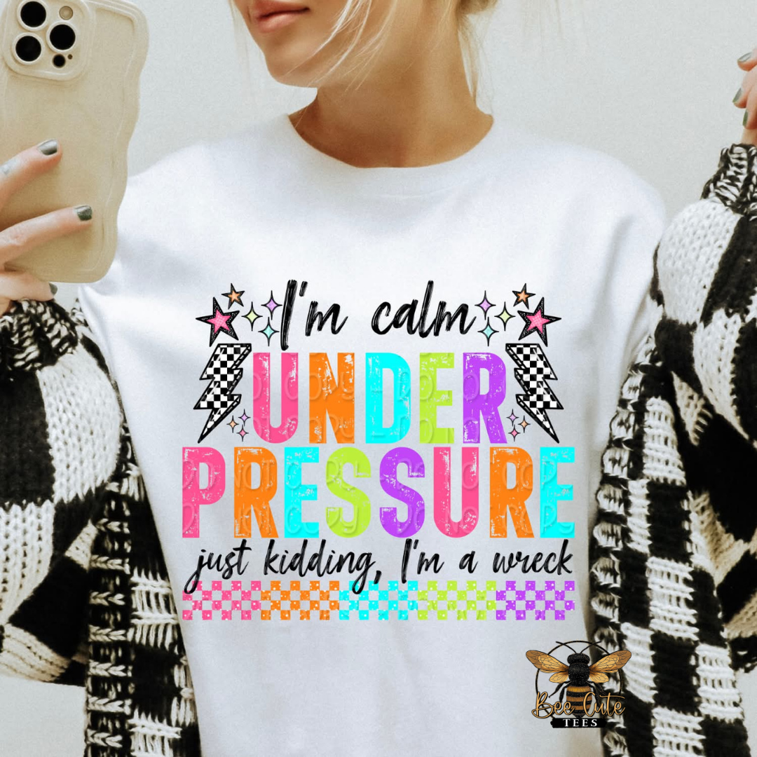 Person wearing a white t-shirt with colorful text design.