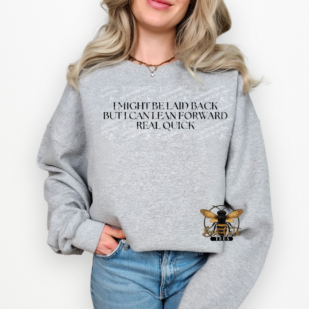 Person wearing a gray sweatshirt with text and a bee logo on a white background