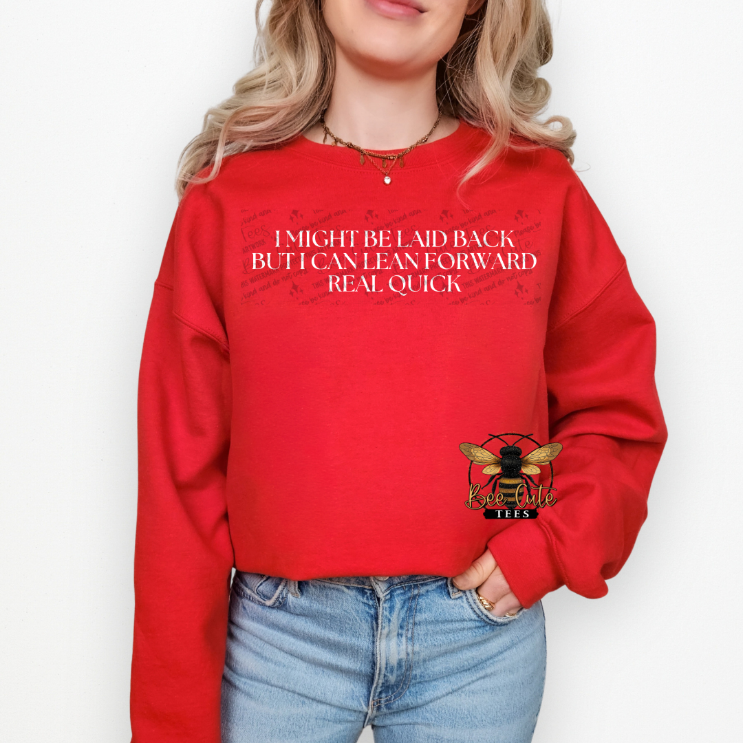 Person wearing a red sweatshirt with text and a logo on a white background
