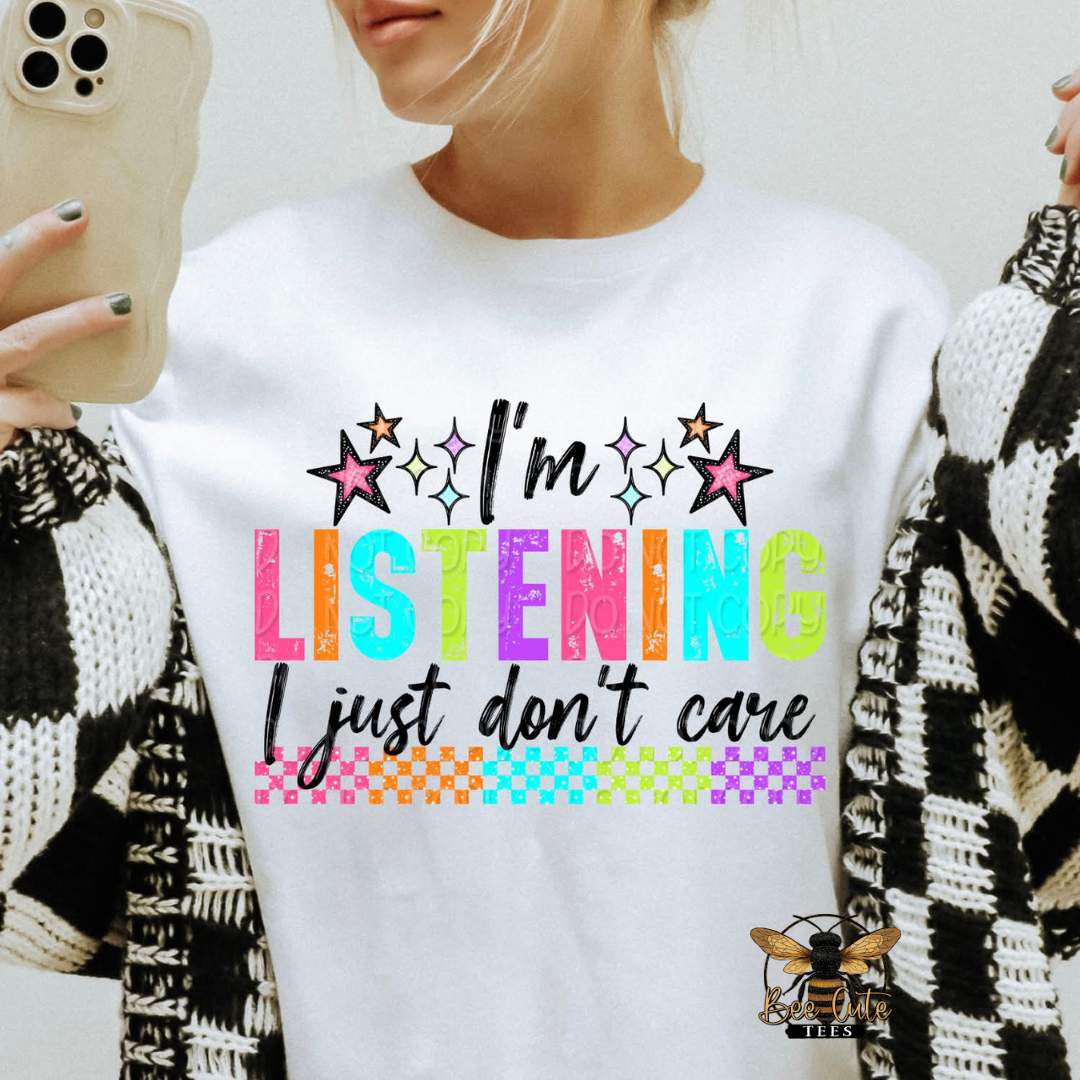 Person wearing a white sweatshirt with colorful text design.