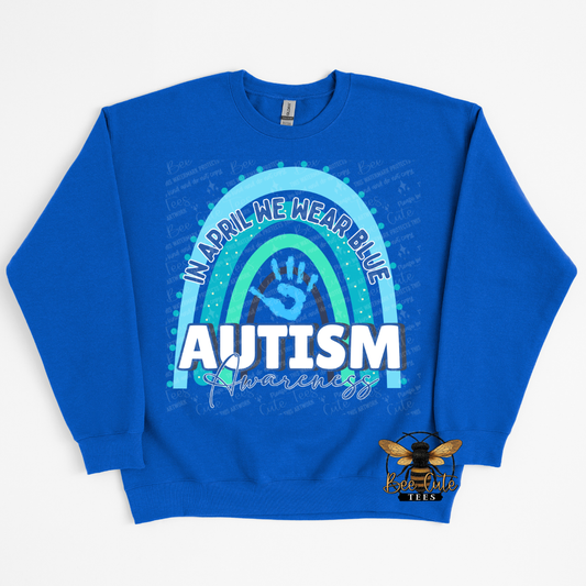 Blue sweatshirt with autism awareness design on a white background