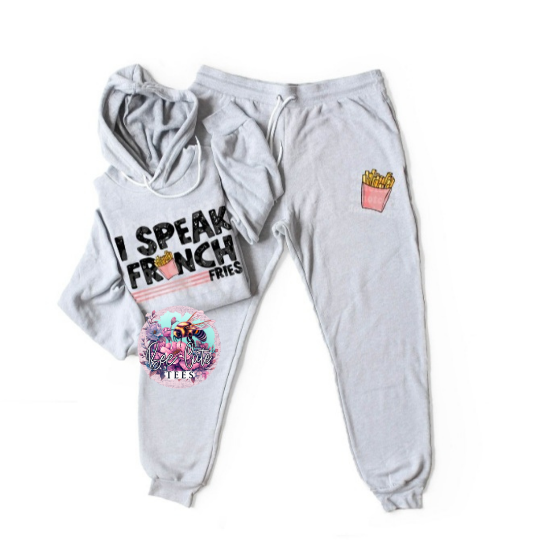 Gray hoodie and sweatpants set with 'I Speak French Fries' text and cartoon design on a white background